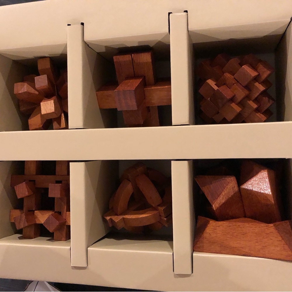 Previously Owned Brain Teaser Puzzles… Never Taken Out of Box